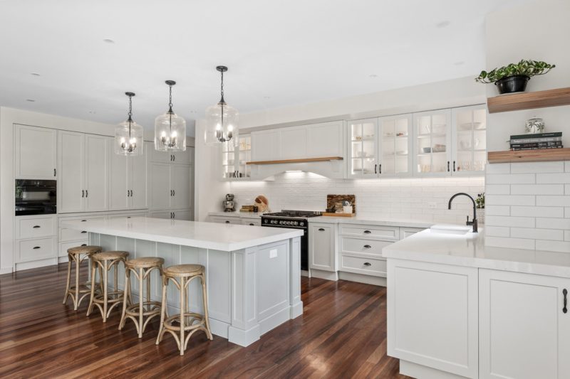 Custom white shaker kitchen renovation in Templestowe with island bench and timber flooring